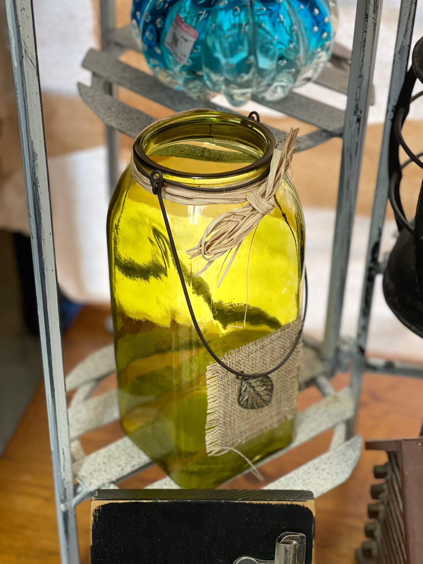 Green glass hanging candle holder
