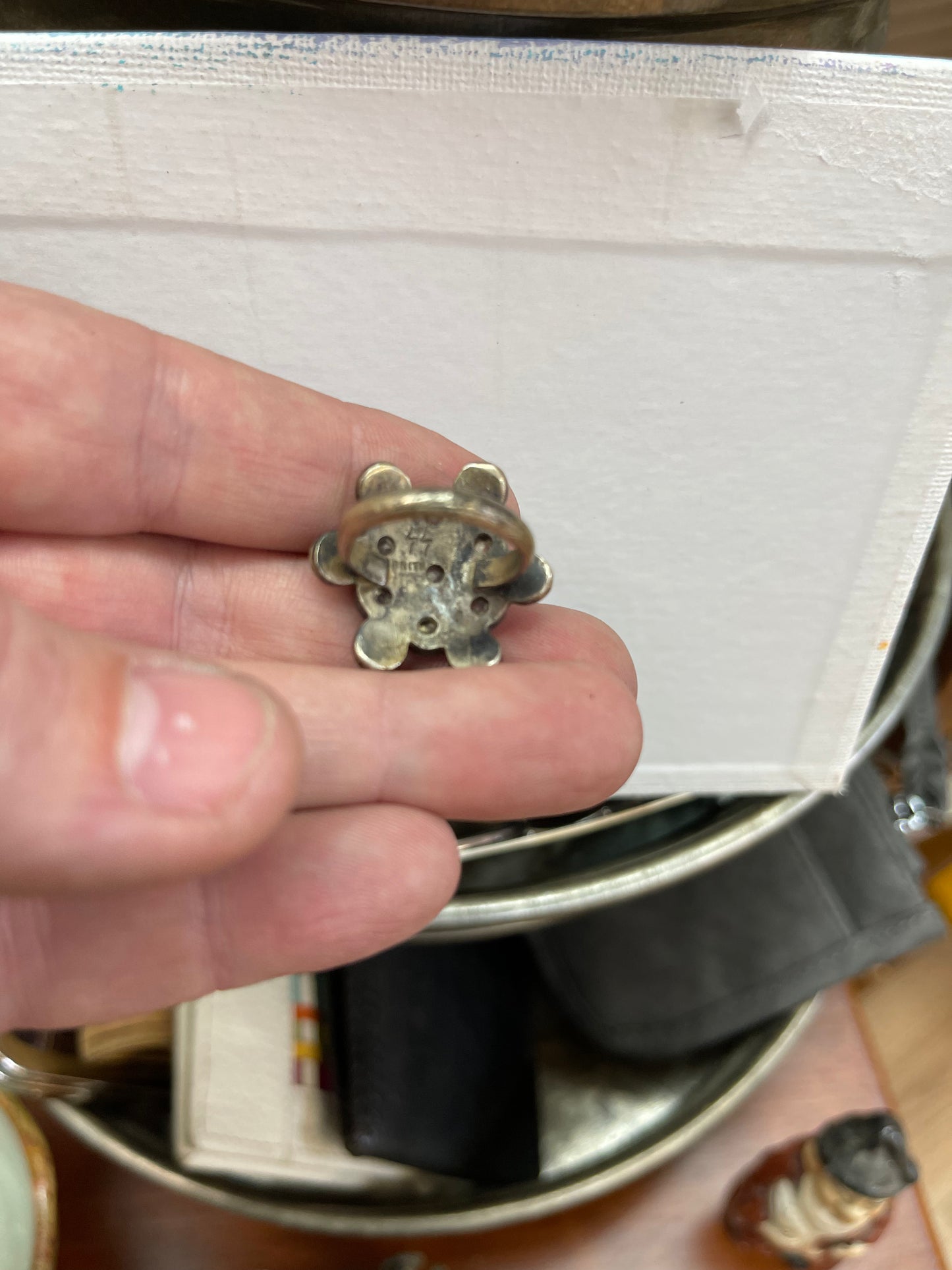 Ring with white and purple stones