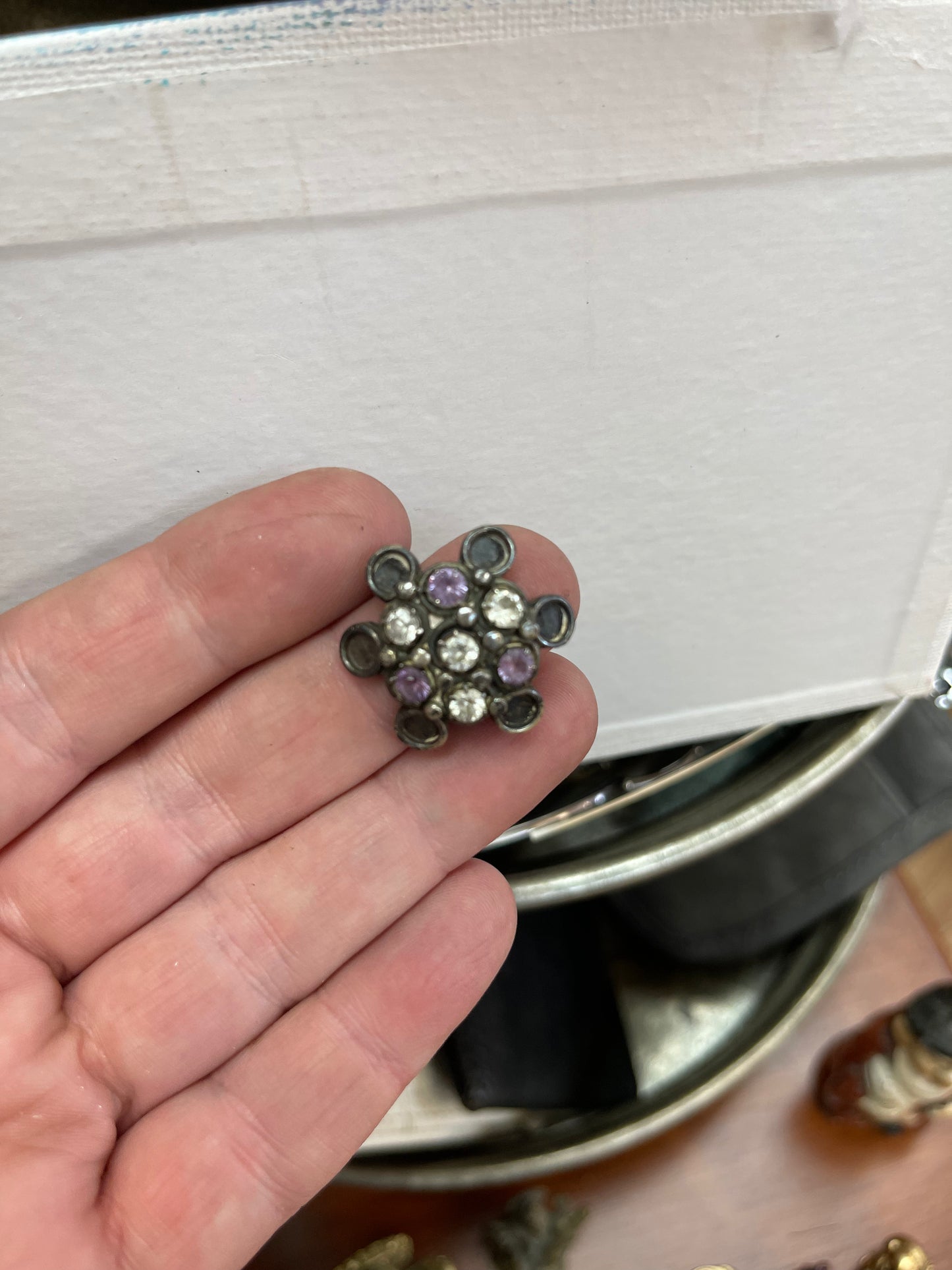 Ring with white and purple stones