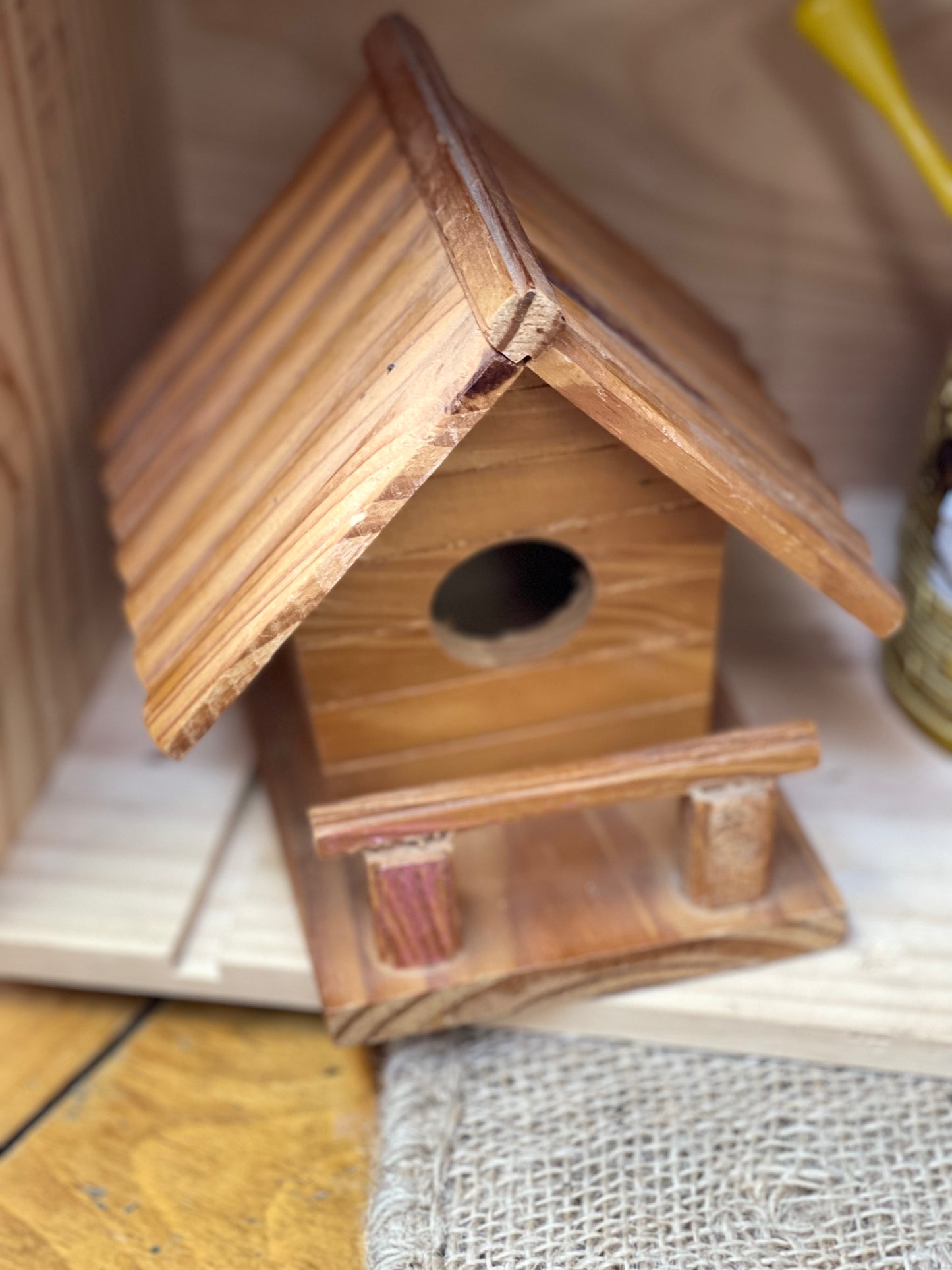 Wooden cabin birdhouse