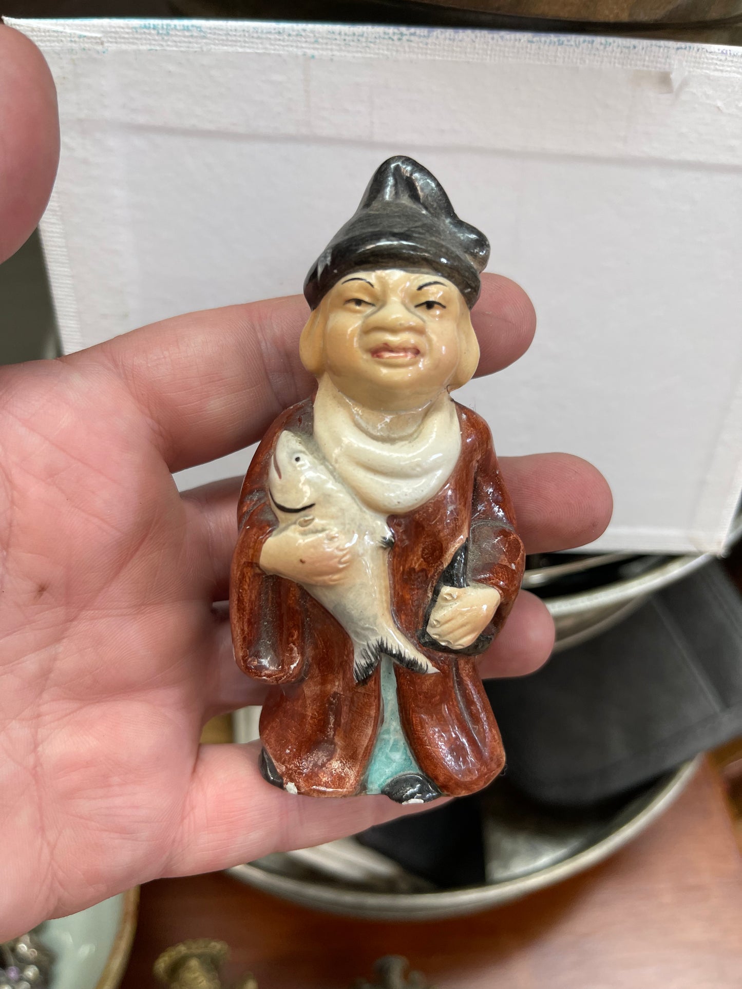 Vintage ceramic figurine with fish