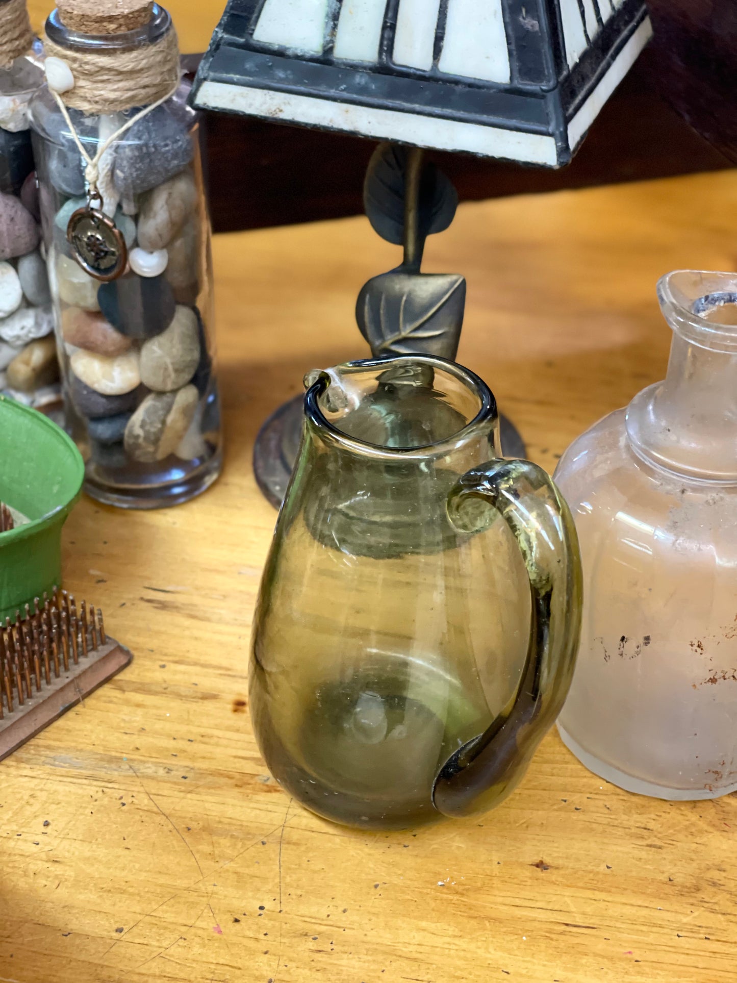 Small green glass pitcher