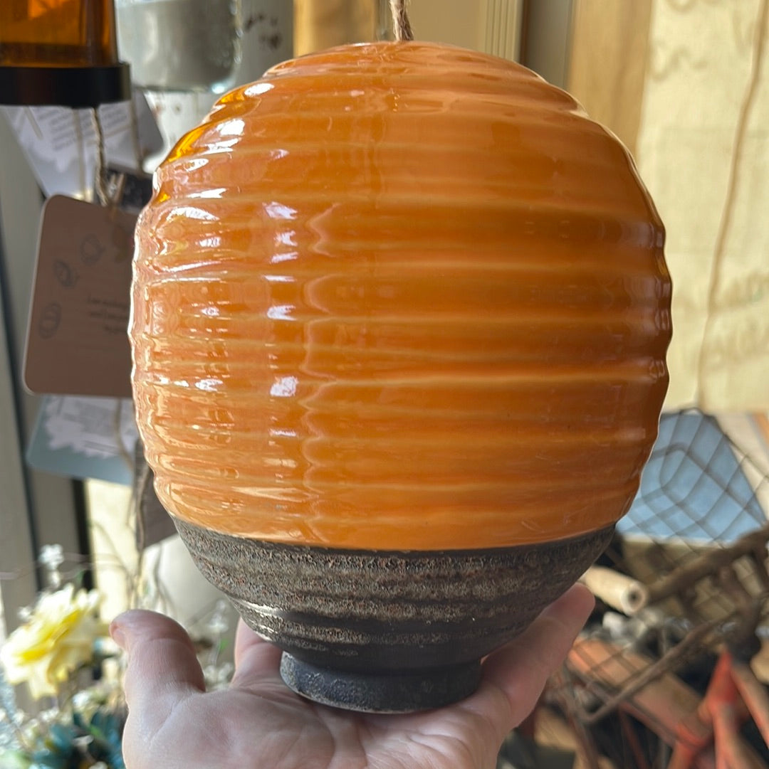 Orange ceramic bird house