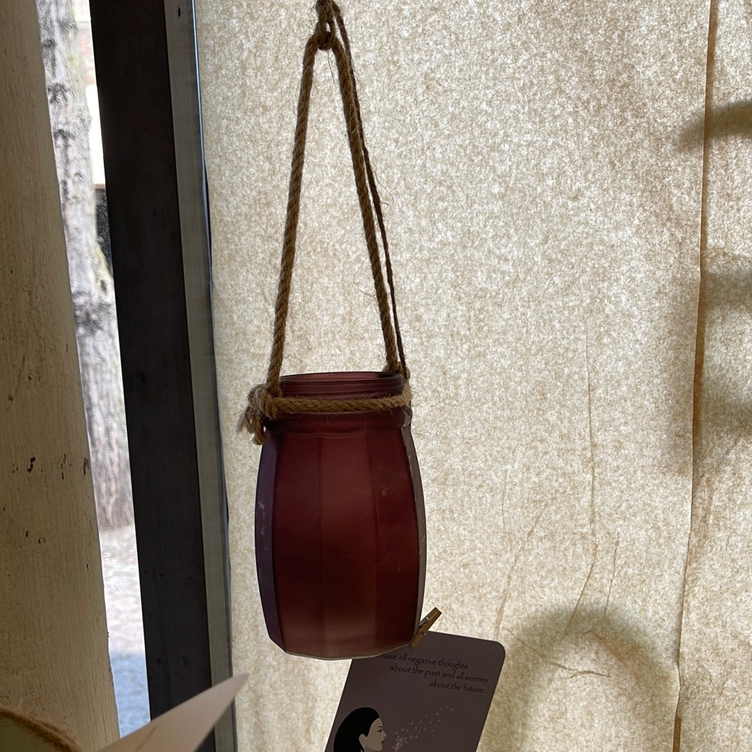 Purplish glass candle hanger