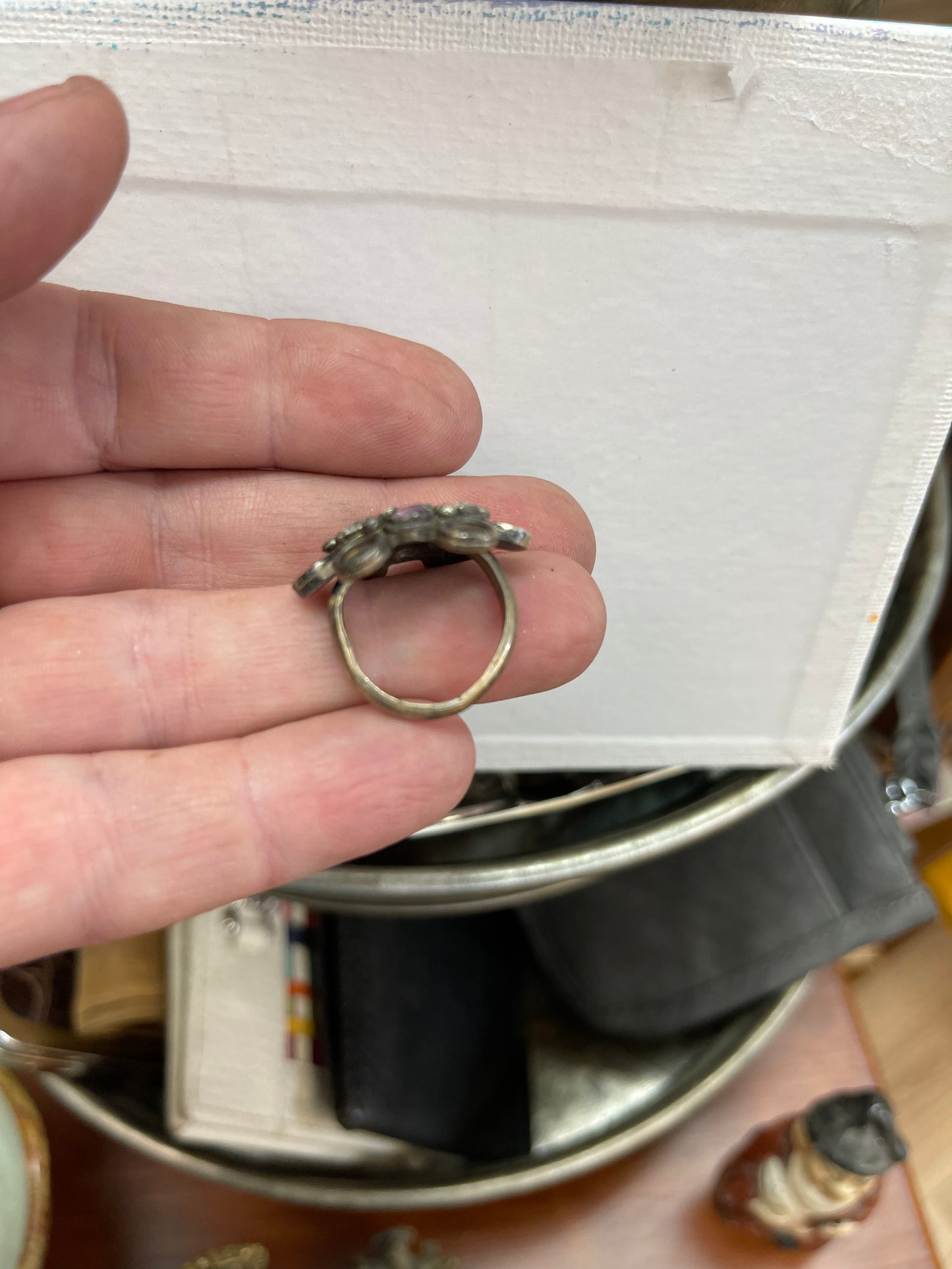 Ring with white and purple stones