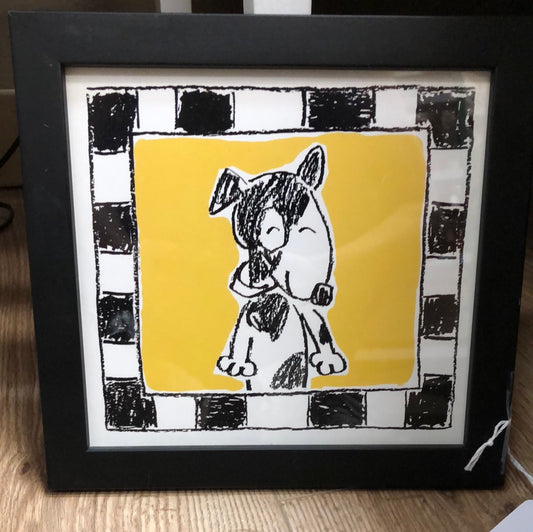 Black/white/yellow framed dog picture