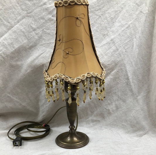 Vintage brass lamp with golden brown beaded lamp shade