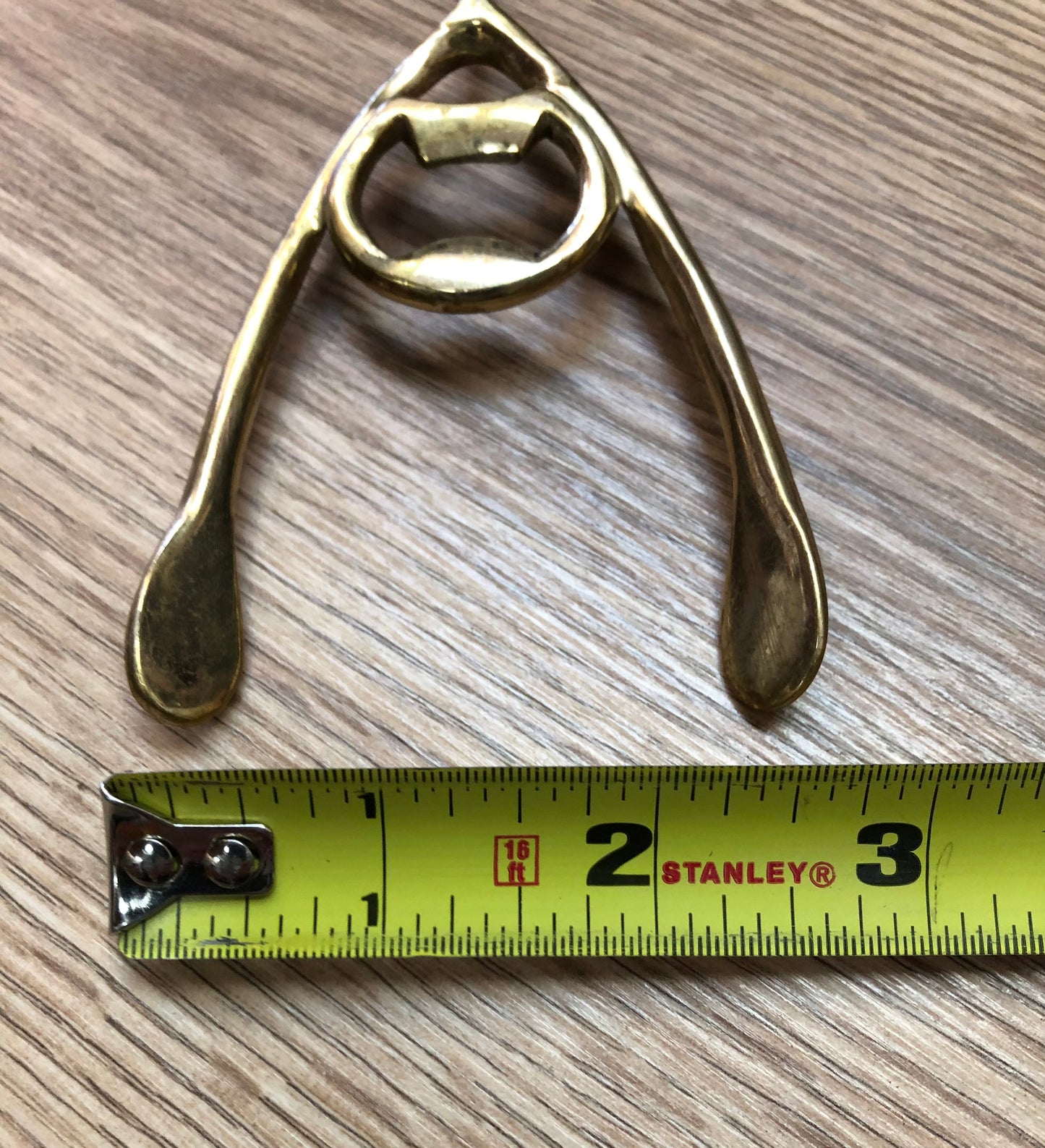Brass wishbone bottle opener